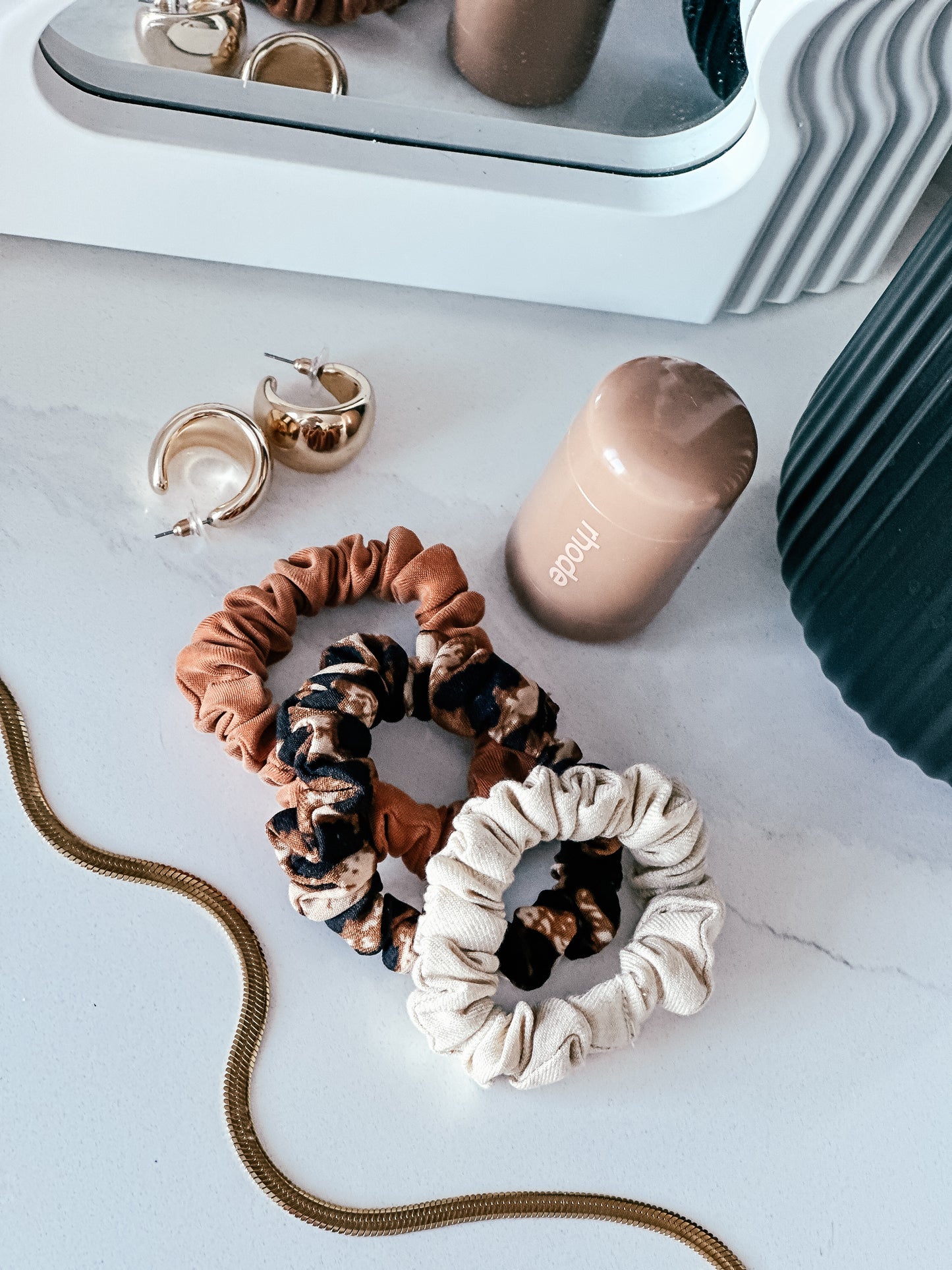 Three matching neutral toned scrunchies - bronze, leopard print and oatmeal