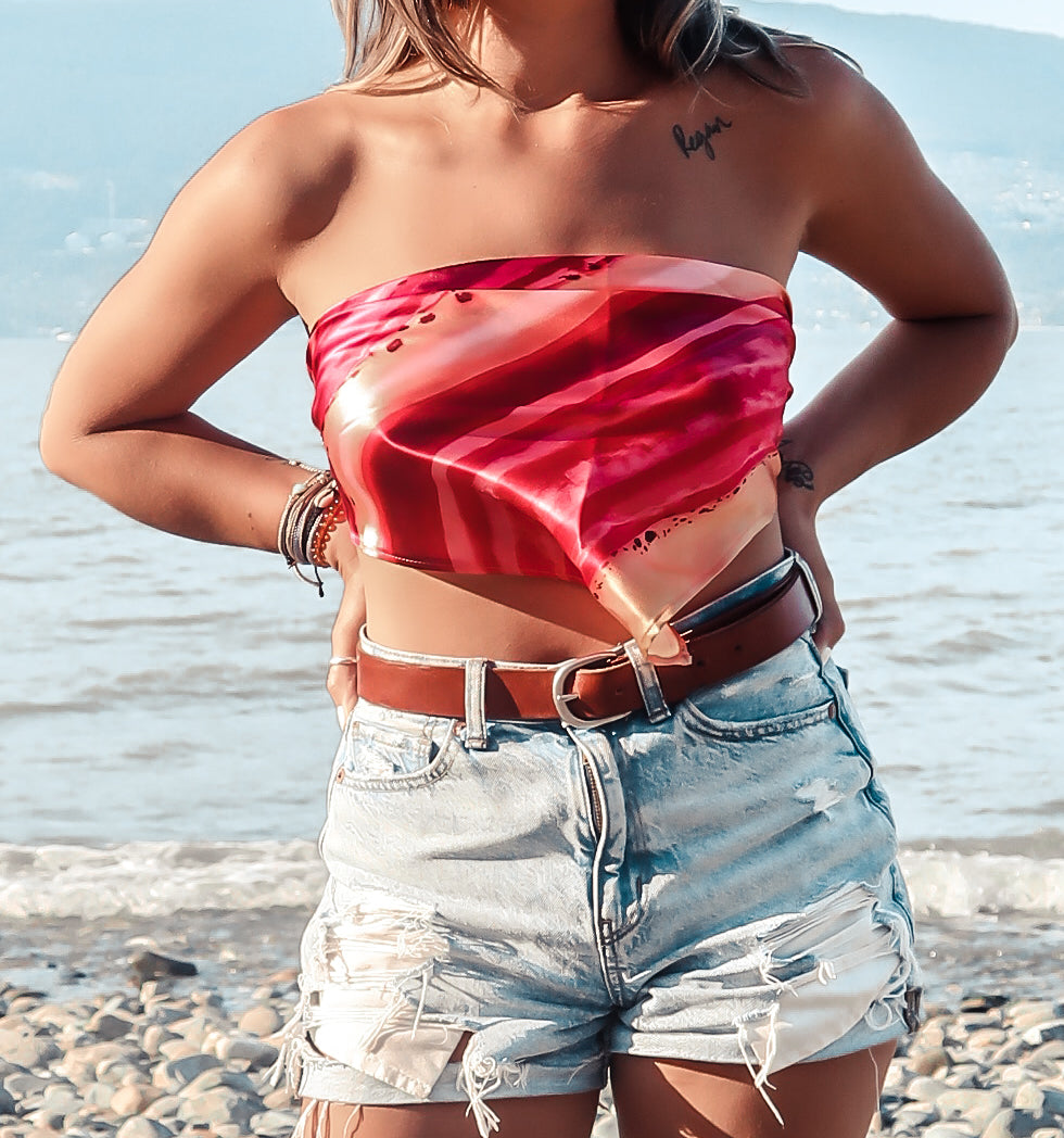 woman wearing fuchsia and peach triangle top