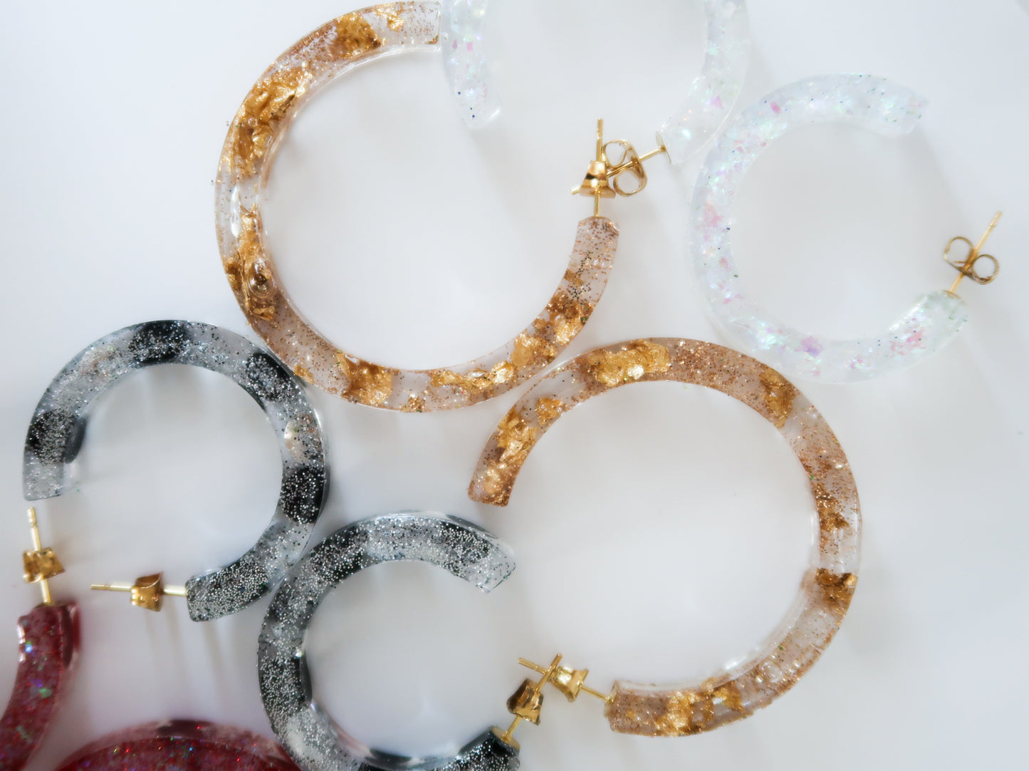 sparky resin hoop earrings in silver gold and white