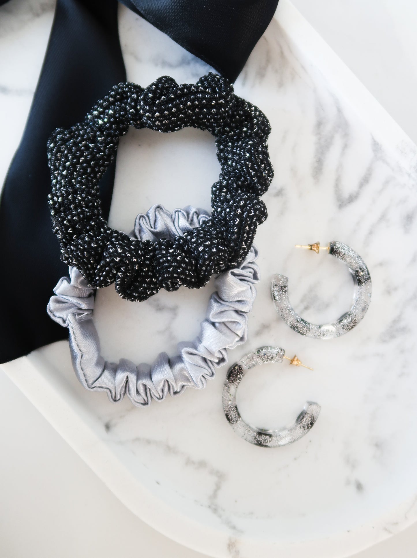 resin earrings paired with metallic silver scrunchies
