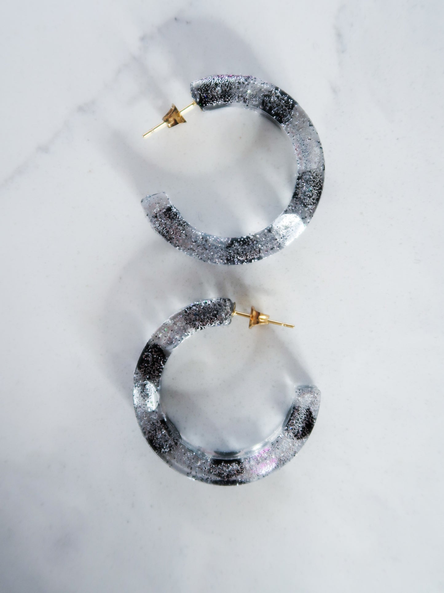 resin earrings with sparkles and sequin details