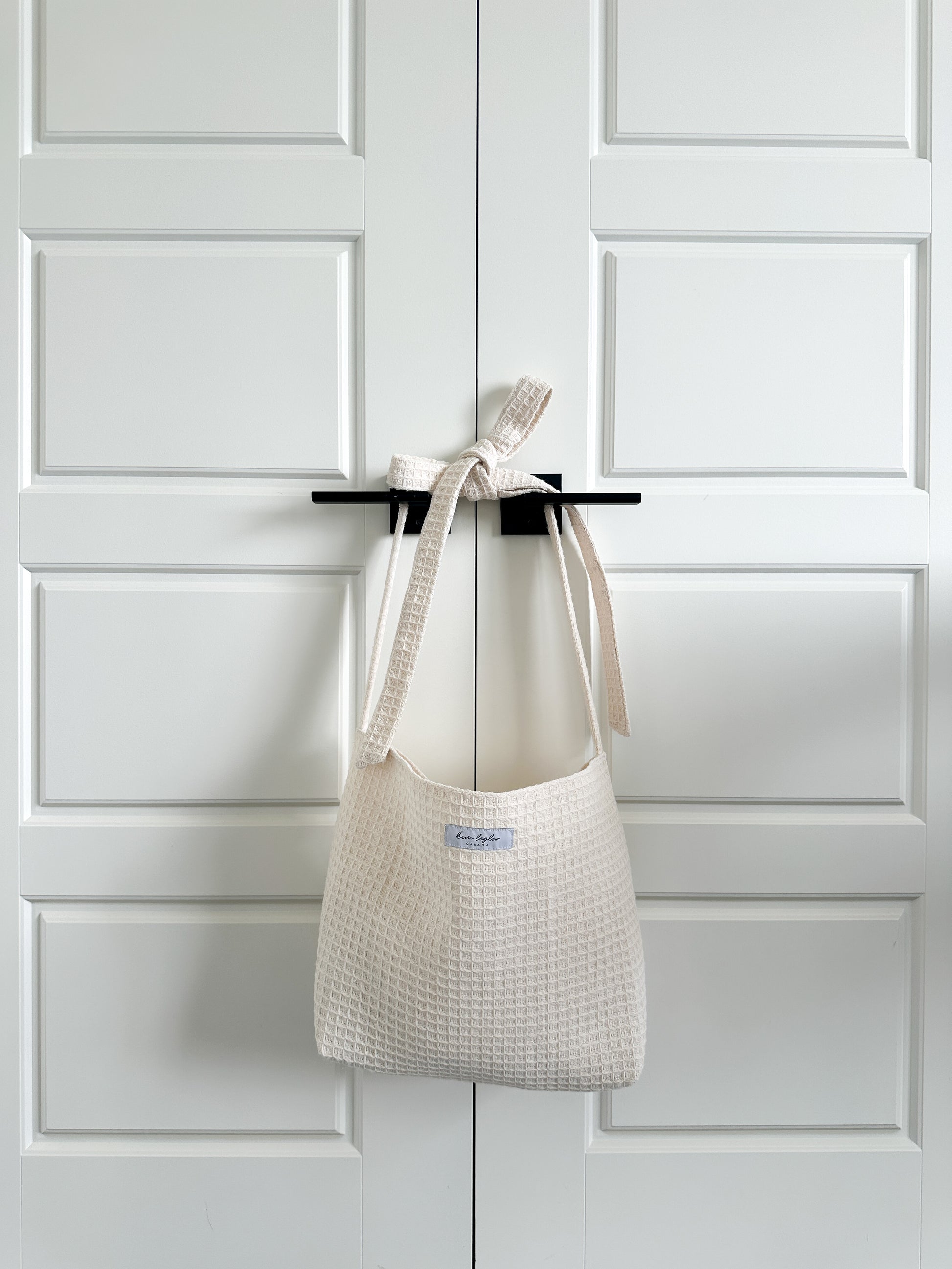 cream tote bag, crafted from premium cotton/jute waffle knit material with elegant bow strap