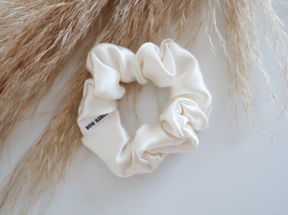 White scrunchie with text on a light background