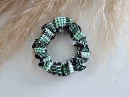 Green and black checkered scrunchie on a light background