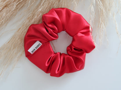 Red scrunchie with a label on a light background