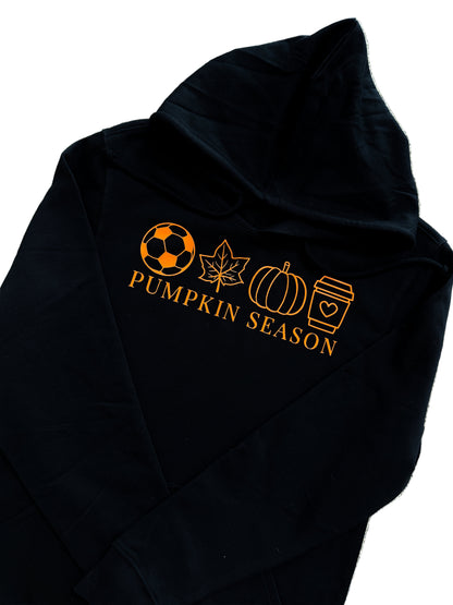 Black hoodie with orange graphics and 'Pumpkin Season' text on a textured surface