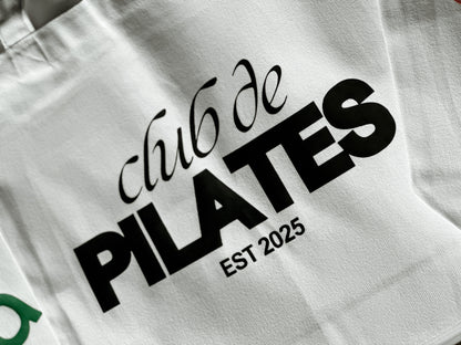 White bag with 'Club de Pilates' text and 'Est. 2025' on a white background