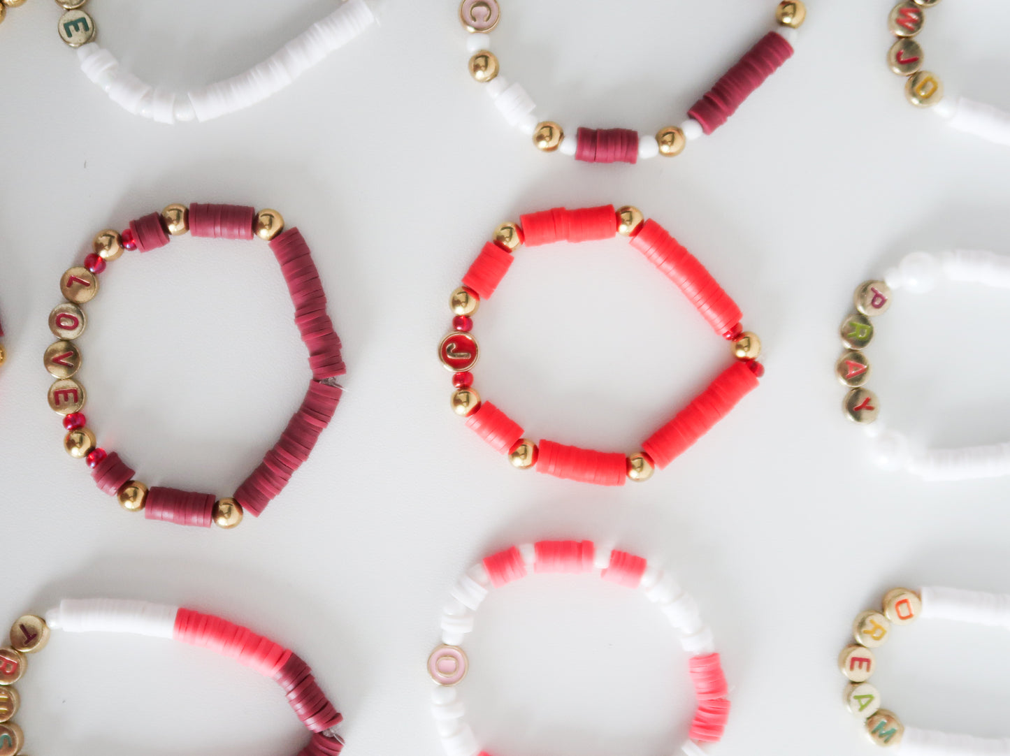Collection of beaded bracelets on a white surface