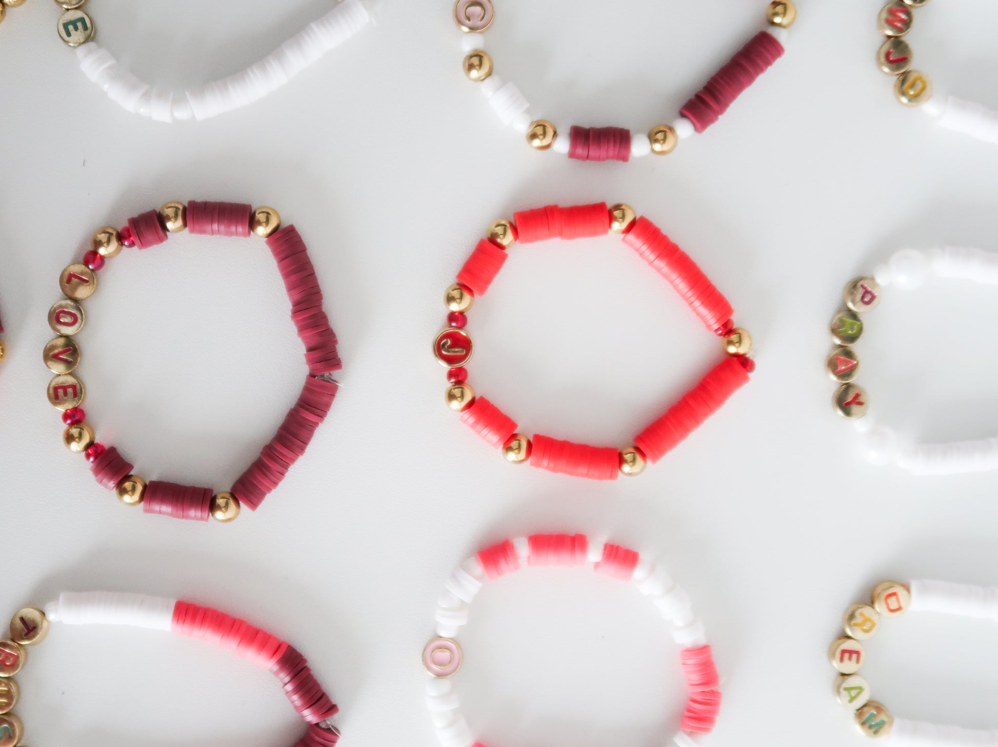 Collection of beaded bracelets on a white surface