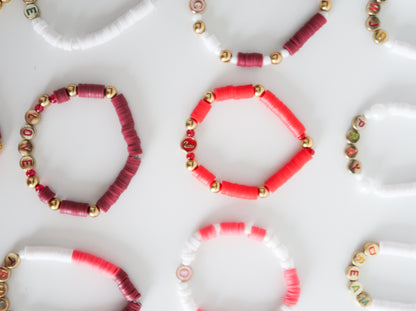 Collection of beaded bracelets on a white surface