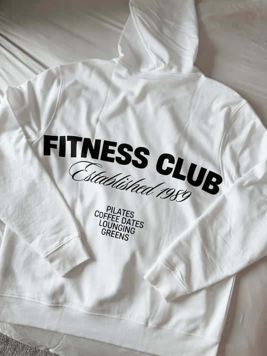 White hoodie with 'Fitness Club' text on a white background
