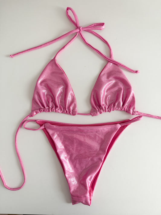 Pink bikini set on a white background