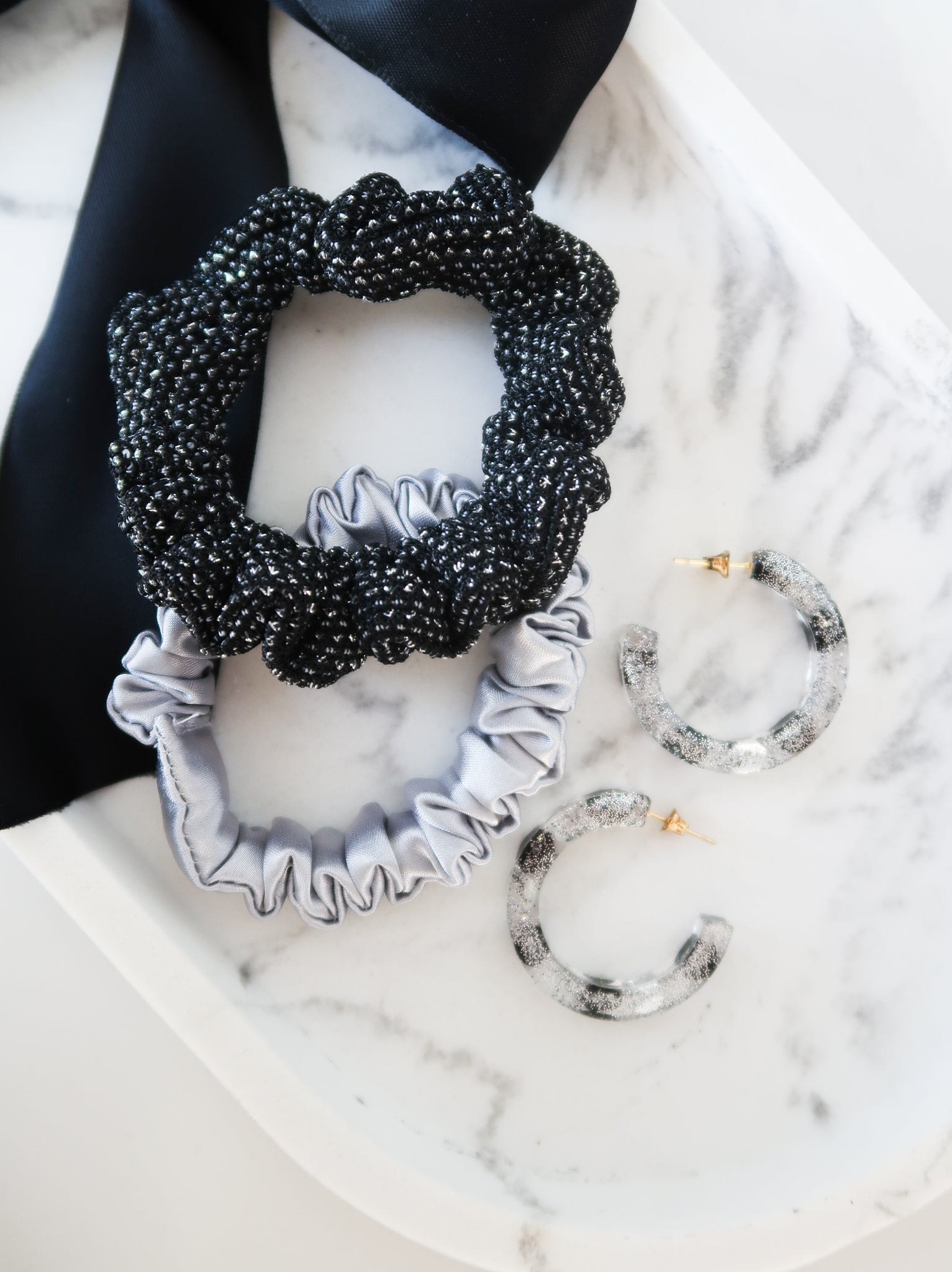 resin earrings paired with metallic silver scrunchies