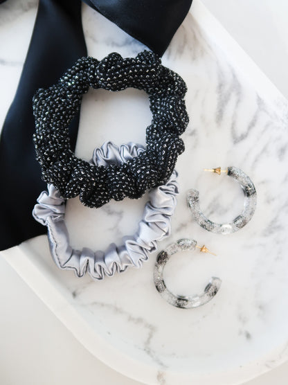 resin earrings paired with metallic silver scrunchies