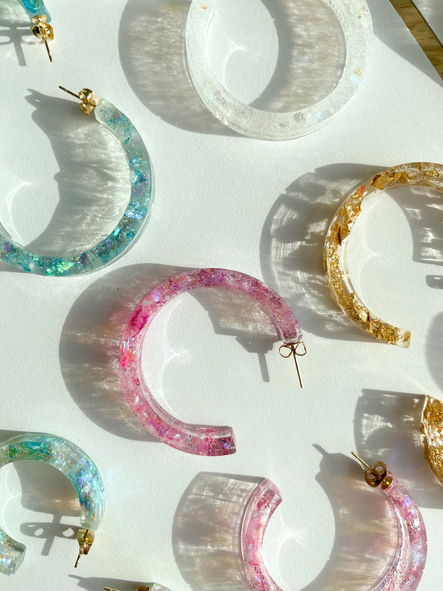 various resin earrings in different colors