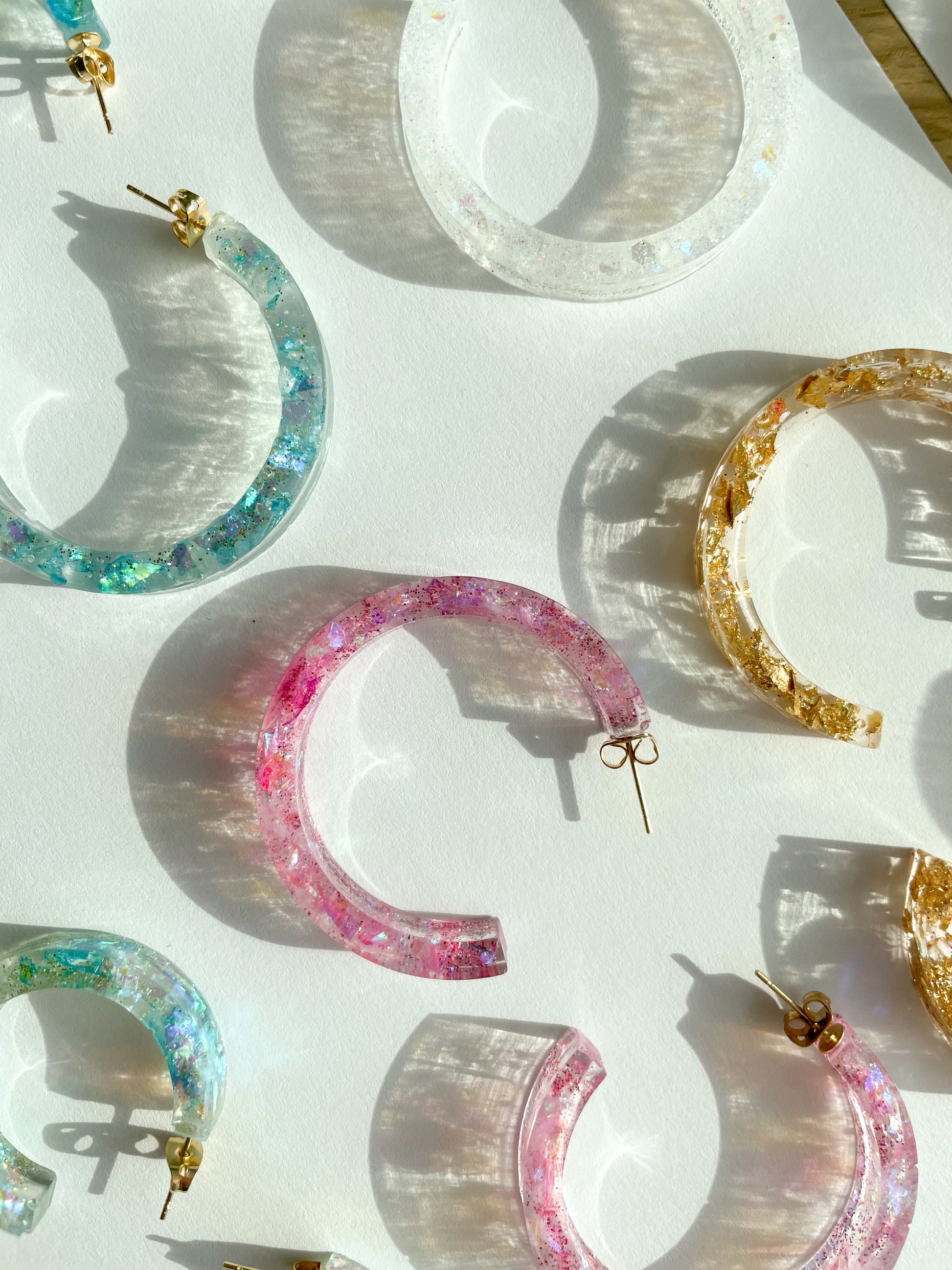 various resin earrings in different colors