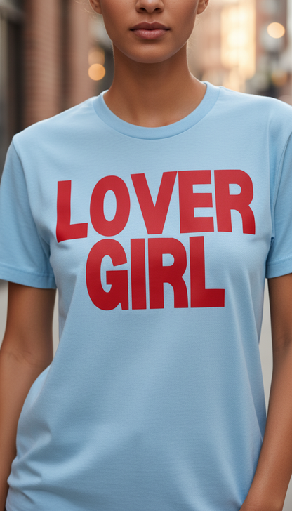 Person wearing a light blue t-shirt with 'LOVER GIRL' in red text.